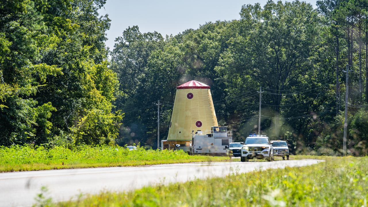 NASA rolled out a key piece of space flight hardware for the SLS (Space Launch System) rocket for the first crewed mission of NASA’s Artemis campaign from Marshall Space Flight Center in Huntsville, Alabama, on Wednesday, Aug. 21 for shipment to the agency’s spaceport in Florida. The cone-shaped launch vehicle stage adapter connects the rocket’s core stage to the upper stage and helps protect the upper stage’s engine that will help propel the Artemis II test flight around the Moon, slated for 2025. Manufactured by prime contractor Teledyne Brown Engineering and the Jacobs Space Exploration Group’s ESSCA (Engineering Services and Science Capability Augmentation) contract using NASA Marshall’s self-reacting friction-stir robotic and vertical weld tools. Crews moved the adapter out of NASA Marshall’s Building 4708 to the agency’s Pegasus barge Aug. 21. The barge will ferry the adapter first to NASA’s Michoud Assembly Facility in New Orleans, where crews will pick up additional SLS hardware for future Artemis missions, before traveling to NASA Kennedy. Once in Florida, the adapter will join the recently delivered core stage. There, teams with NASA’s Exploration Ground Systems will prepare the adapter for stacking and launch